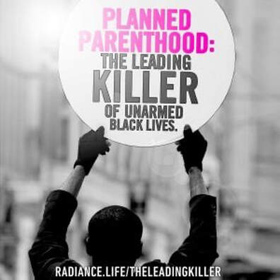 A person holding up a sign that reads " planned parenthood : the leading killer of unarmed black lives."